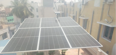 Solar panels installed on a rooftop in a residential area.