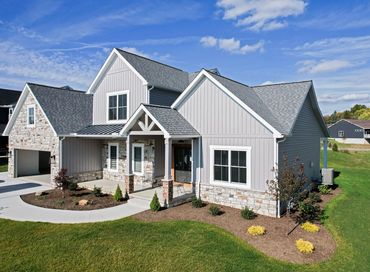 house with pewter provia board and batten siding