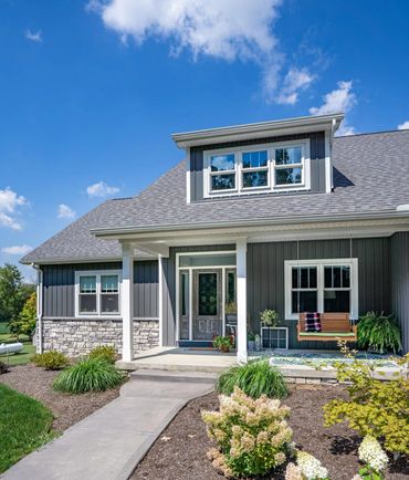 house with gray provia board and batten siding