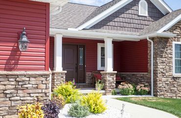 House with red vinyl siding