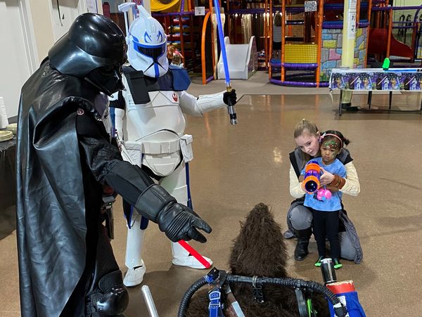 Houston superhero birthday party characters teach the heroes saber training at Kanga's in Cypress