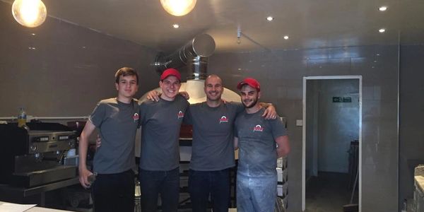 The original woodz pizza team that was there for the opening of woodz pizza first trading day