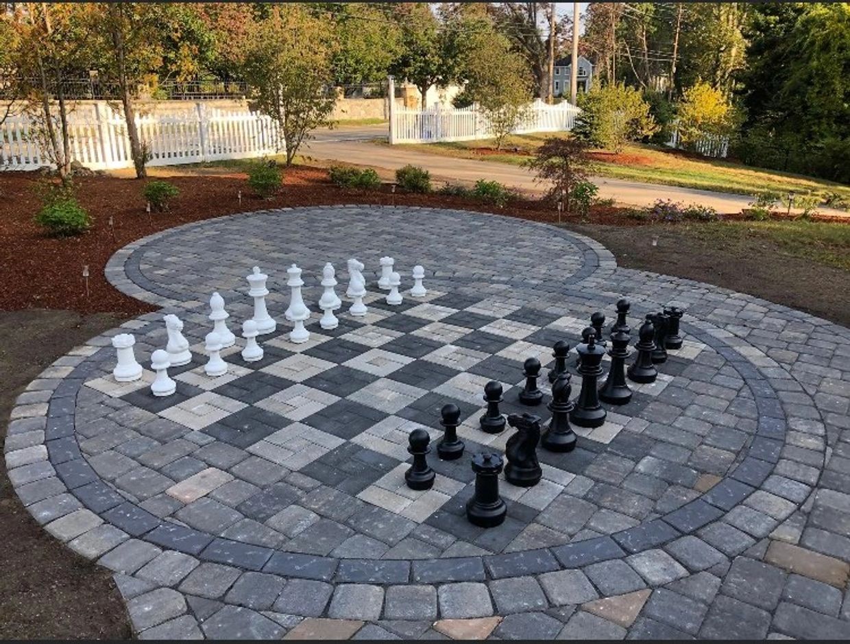 Paver chessboard, hardscape design with large chess board in design.