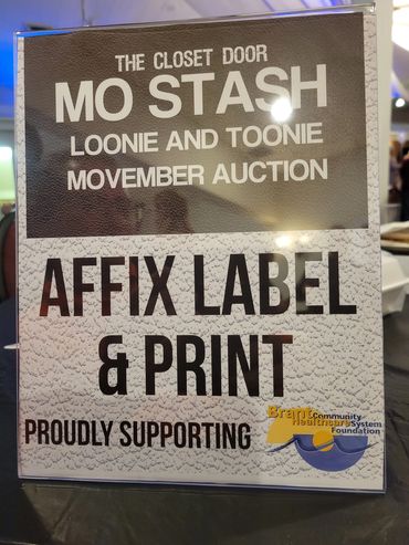 Affix Label and Print table placard for the Mo Stash Loonie and Toonie Movember auction.
