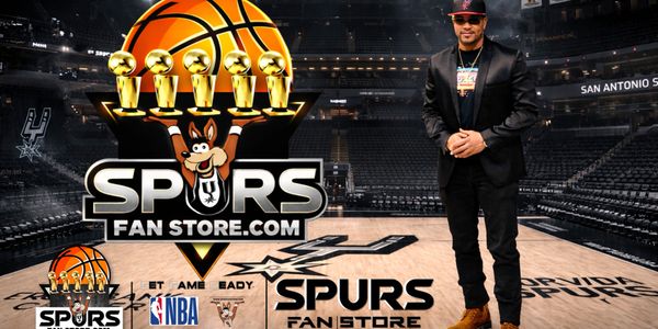 Man posing inside an empty San Antonio Spurs basketball arena with Spurs Fan Store logo.