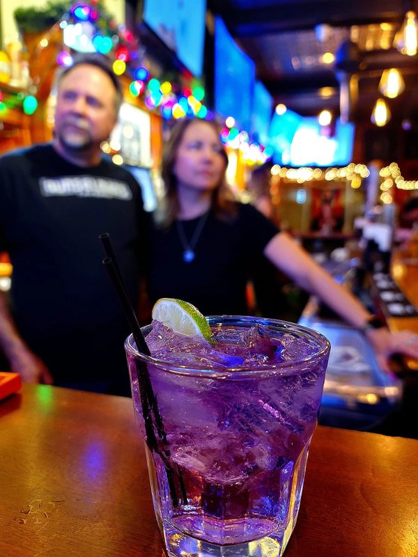 Gunselman's Tavern Bartenders featuring their Purple Haze Cocktail 