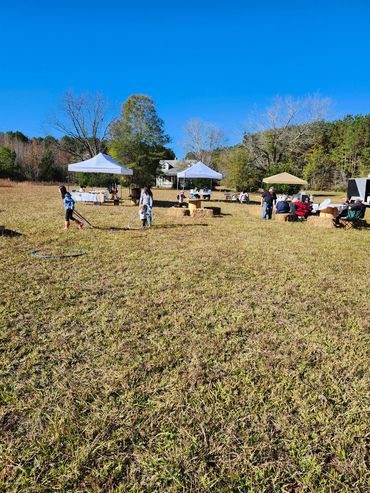 Farm event. Tents. Vendors. Families. Kids.