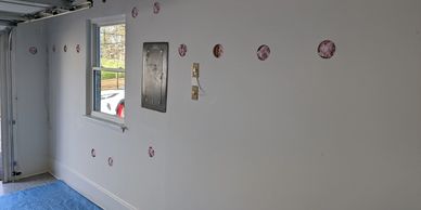 Fiberglass Insulation installed in garage wall and ceiling