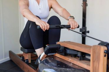 Rowing on a rower in a private gym
