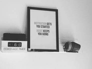 Motivation sign in a personal trainer's private gym