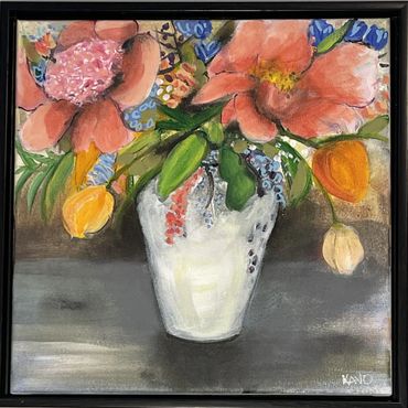 colorful garden flower pickings in a white vase,