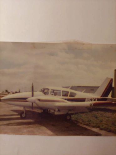 Twin-engine plane parked outdoors