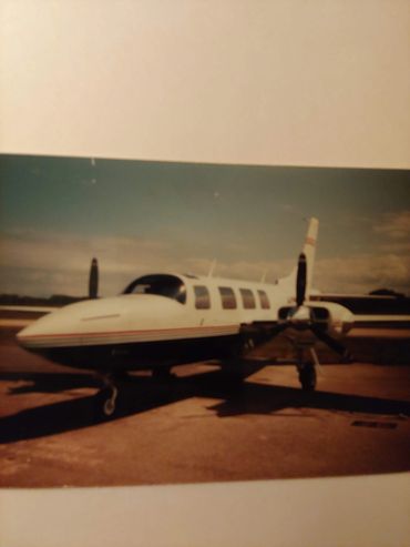 Small private jet parked on tarmac