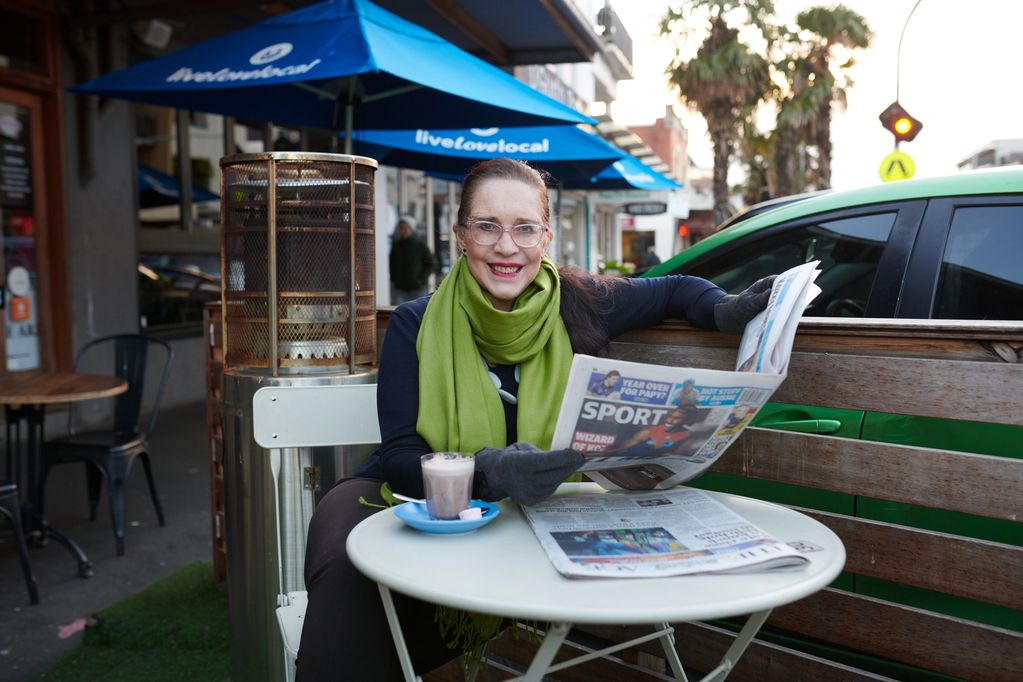 Sally reading the papers at one of the many cafes and restaurants in the area.
