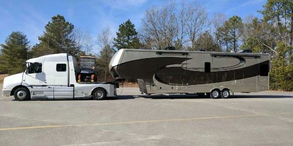 New Volvo heavy duty tow vehicle with 48 foot luxury full time fifth wheel trailer