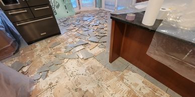 Flooring removal, including carpet, ceramic tile, vinyl and laminate.