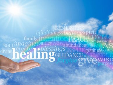 Cloudy sky background with a rainbow coming from a hand. The words "healing, guidance, forgive".