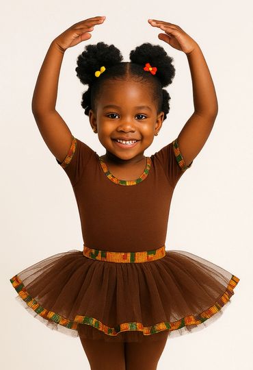 Smiling little girl in brown ballet outfit posing with hands above her head.