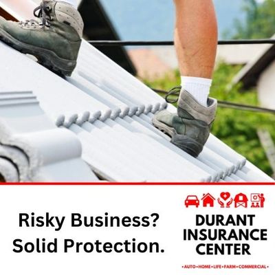 Worker wearing safety boots on a roof, representing risk management & business insurance.