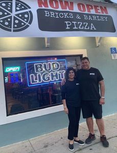 Proud new owners of the best pizza place on the beach.