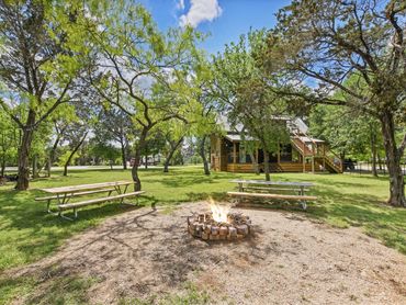 Firepit, Picnic, Ranch Games and Grilling Area at Cedar Bend RV Park in Bertram Texas Near RV Sites