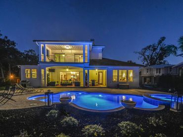 A view of a property with a pool along with a beautiful theme and background