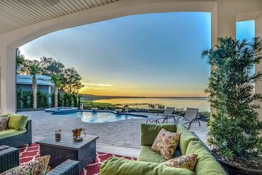 A view of a property with a pool along with a beautiful theme and background