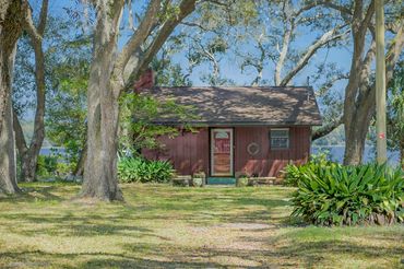 A view outside a property surrounded by trees along with a beautiful view and theme