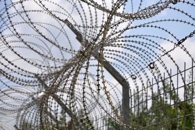 Prison fence with barbed wire.