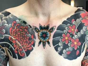 traditional flower tattoo chest piece