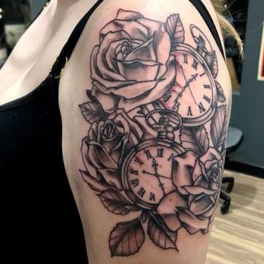 Rose and watch black and grey arm tattoo