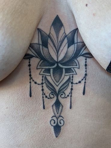 chandelier lotus chest tattoo