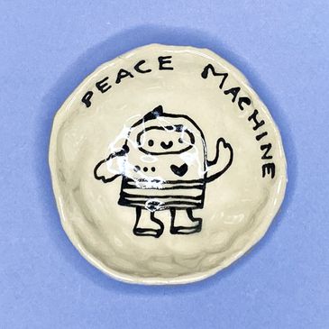 Cute Robot painted on small ceramic dish, black and white drawing, with the words, "PEACE MACHINE" a
