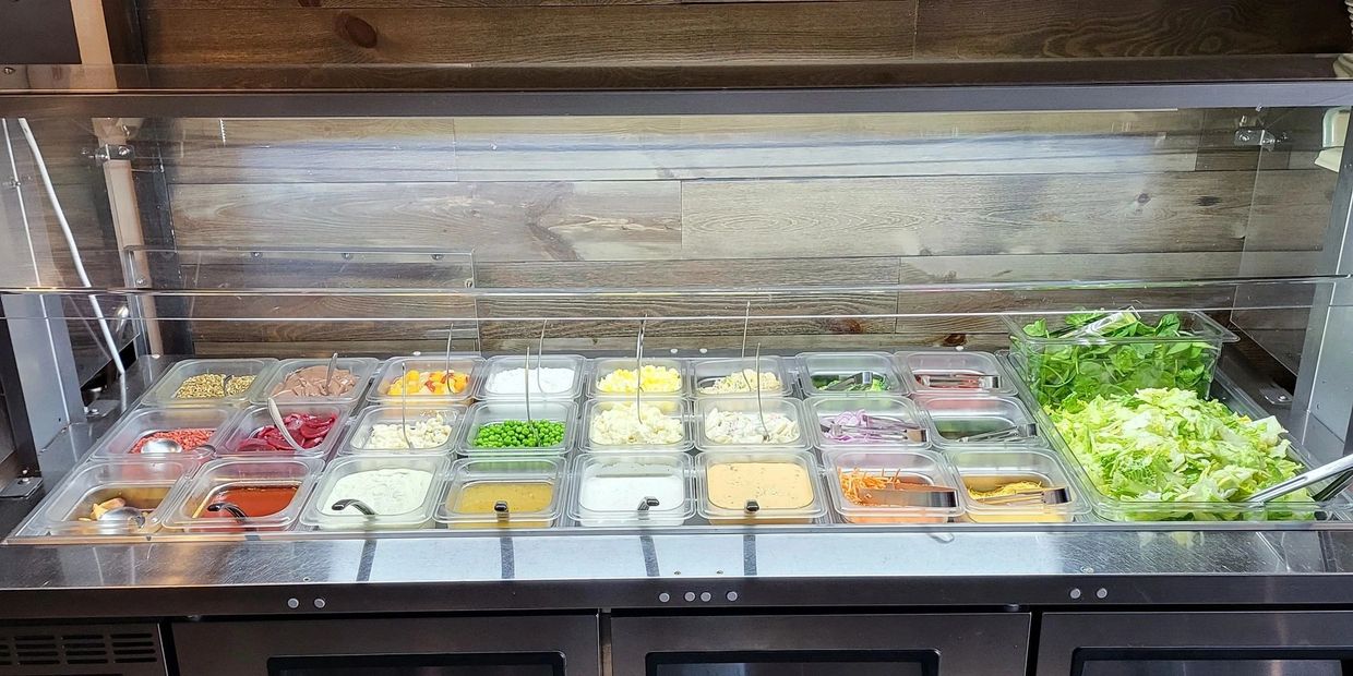 Food arranged in different sections on display