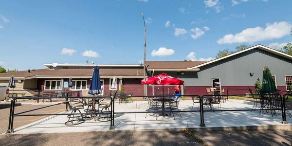 Exterior view of the restaurant with tables and chairs