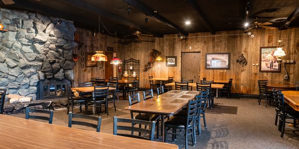 Restaurant inside view with tables and chairs image