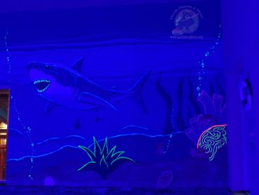 Black light shark mural