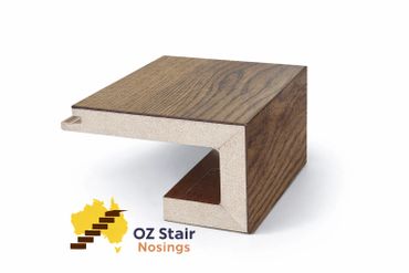 Cross-section of a wooden stair nosing with logo.