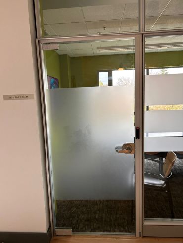 Glass door with frosted design