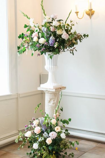 Tall fresh floral urn and matching meadow at the base for a romantic look. beech and garden roses