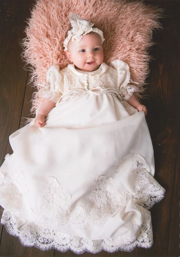 christening dress made from fabric and lace of a grandmother's wedding gown