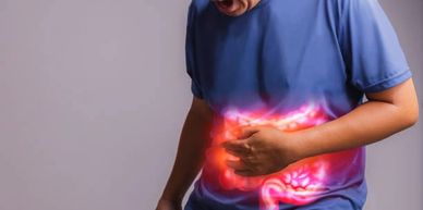 A patient experiencing abdominal discomfort, a common symptom of IBS.