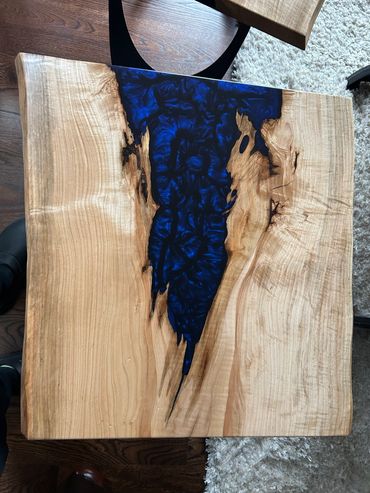 Wood and blue resin river table.