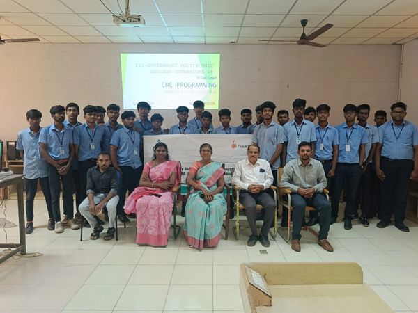 Group photo of students and faculty during a CNC programming orientation at a polytechnic college.