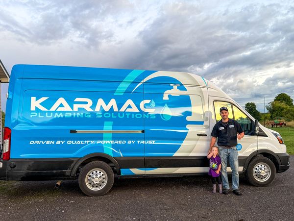 Plumbing van with owner and daughter