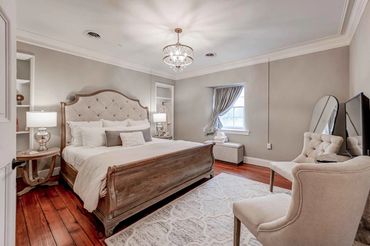 Luxury-hotel-quality bedroom suites feature rich decor