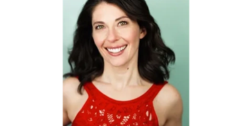 Smiling woman with dark hair in a red sleeveless top.