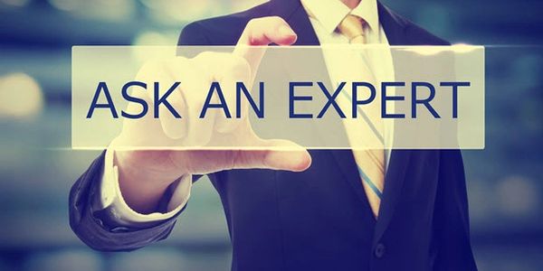 Man holding "ask an expert"