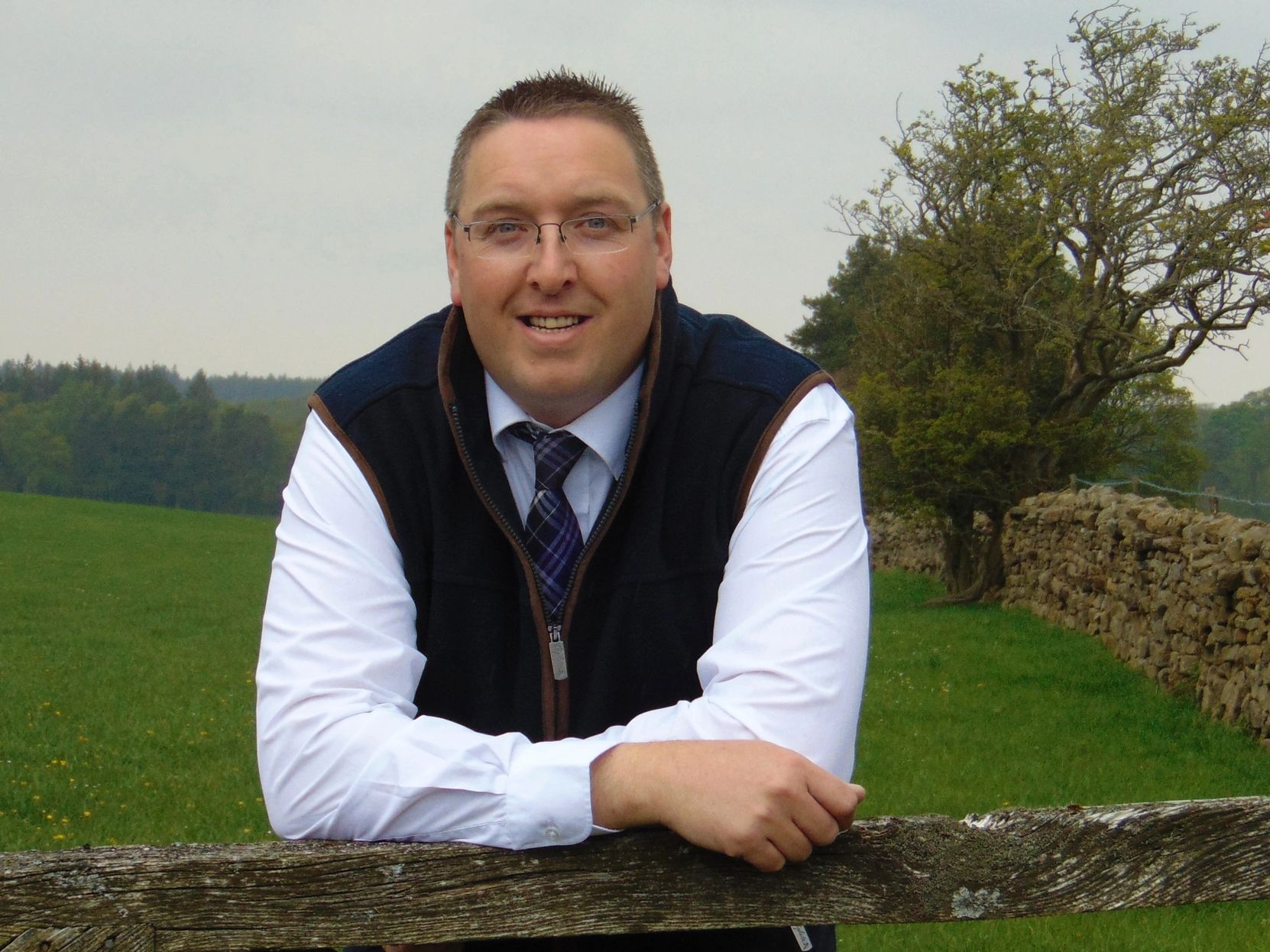 Andrew Hardcastle leaning on a gate