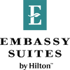 White letter E with a leaf on a teal background.
